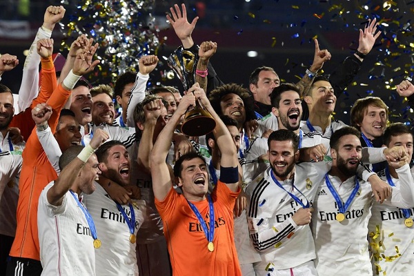 Real Madrid players pose with the Champions League trophy, after winning the Champions League final soccer match between Atletico Madrid and Real Madrid, at the Luz stadium, in Lisbon, Portugal, Saturday, May 24, 2014