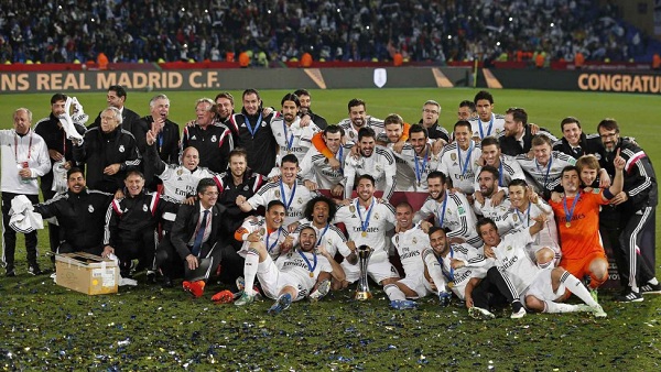 Real Madrid players pose with the Champions League trophy, at the end of the Champions League final soccer match between Atletico Madrid and Real Madrid in Lisbon, Portugal, Saturday, May 24, 2014. Real Madrid won 4-1