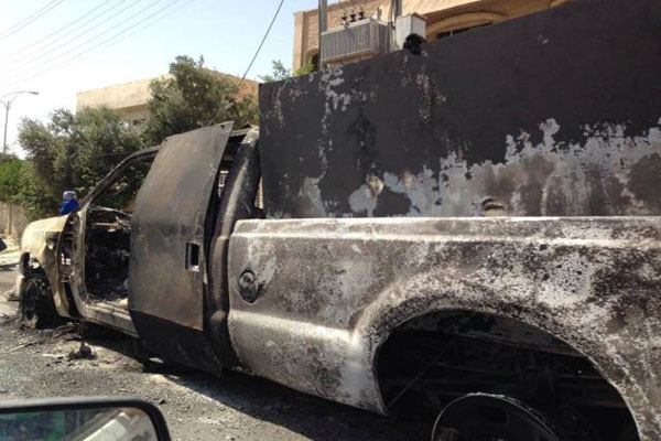 عربة عسكرية محترقة في الموصل